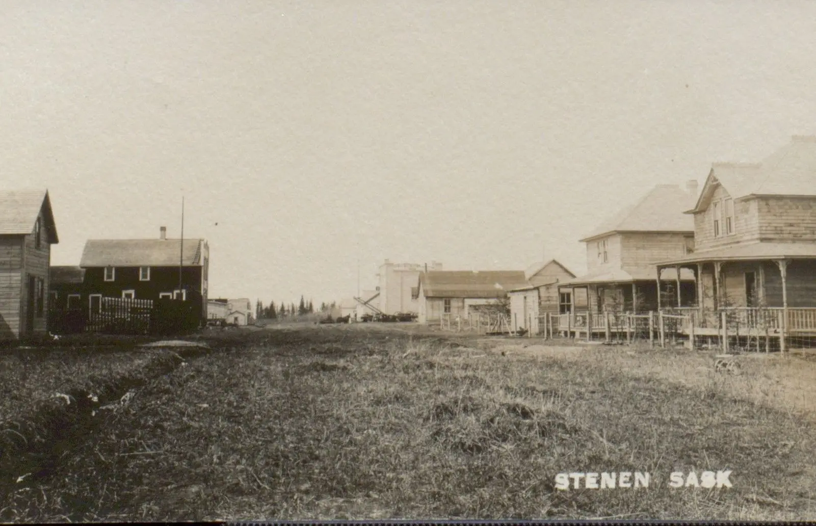 Street view of Stenen with houses and early buildings